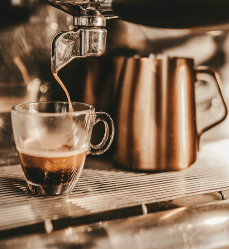 Barista pouring a cup of coffee